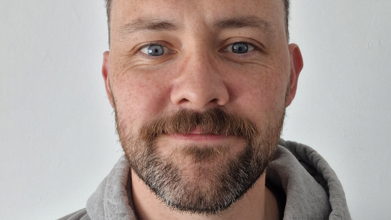 image shows a close up shot of jordan smiling to camera