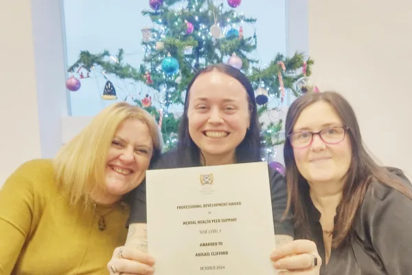 Image shows Ab with her certificate