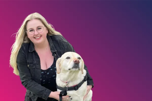 Image shows Kayleigh and her lovely dog, smiling to the camera.